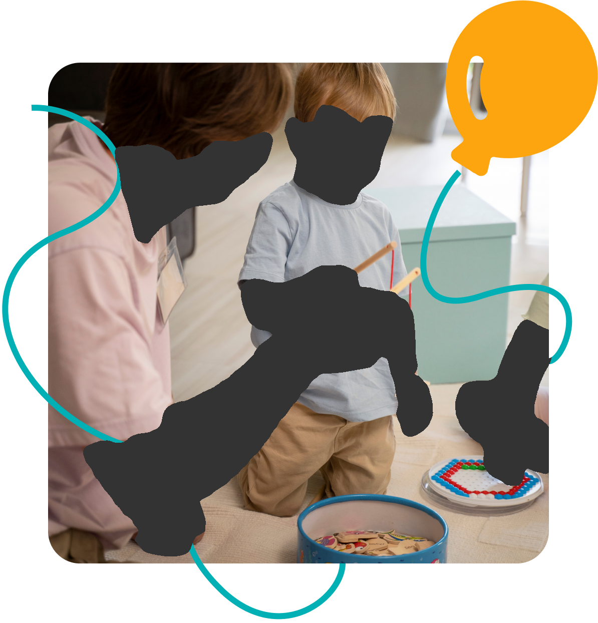 A person shows a wooden toy to a smiling child, who is standing on a rug.