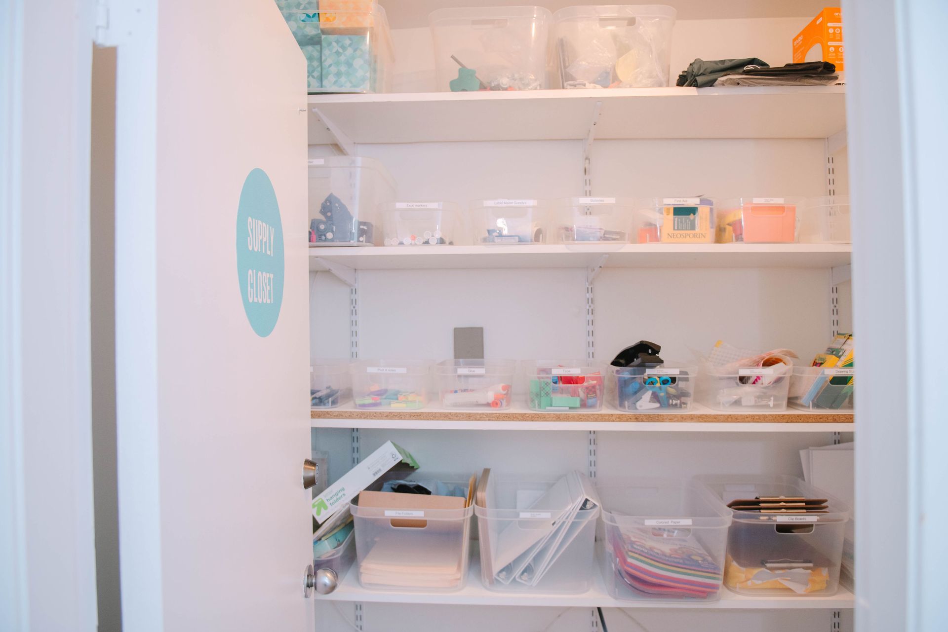 A closet filled with lots of shelves and boxes.