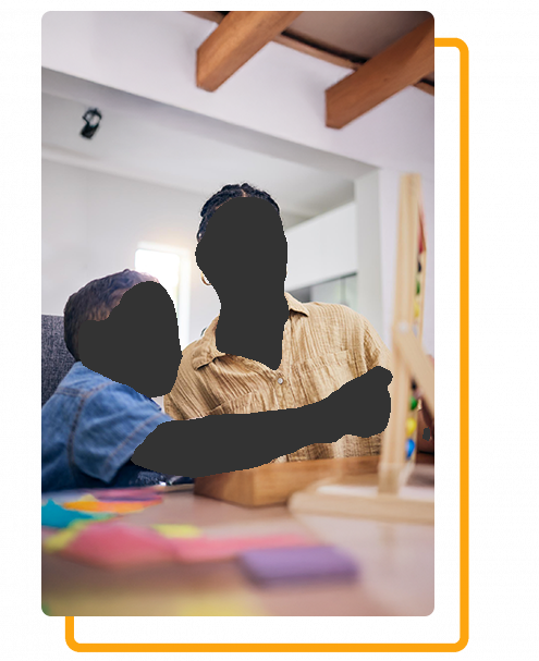 Woman and child playing with educational wooden toy at a table.