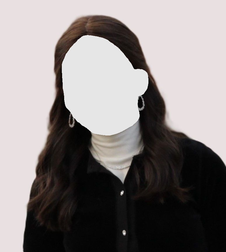 Woman with dark hair smiles, wearing a black jacket and white turtleneck. She has diamond earrings.