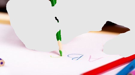 Adult hand guiding a child's hand to draw with a green colored pencil on white paper.