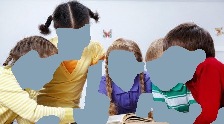Five children looking at a book together, possibly reading, in a bright setting.